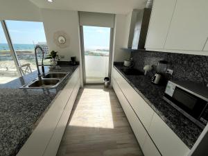 Kuchyň nebo kuchyňský kout v ubytování Karibao Ecuabook Familiar 7A