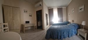 Postel nebo postele na pokoji v ubytování Albergo ristorante Da Tunon