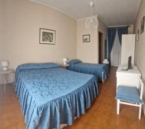 Postel nebo postele na pokoji v ubytování Albergo ristorante Da Tunon + 16 fotografií