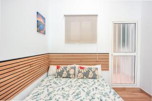 Ένα ή περισσότερα κρεβάτια σε δωμάτιο στο J&N Apartament La Palmera 3