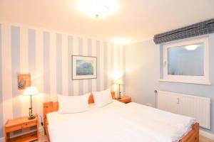 Ένα ή περισσότερα κρεβάτια σε δωμάτιο στο Feskerdamm 28