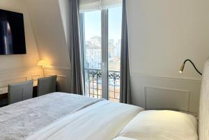 Säng eller sängar i ett rum på Suite vue Tour Eiffel