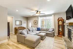 a living room with a couch and a fireplace at 4 Mi to Marina and Boat Ramp Lake Murray Getaway! in Chapin