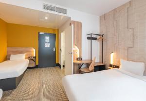 Postel nebo postele na pokoji v ubytování B&B HOTEL Lyon Ouest Tassin