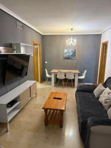 a living room with a couch and a table at Beautifull Apartment in Benidorm in Benidorm