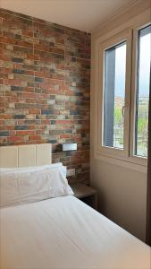 Postel nebo postele na pokoji v ubytování Colectia Hotel Urumea