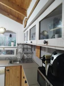 Kuchyň nebo kuchyňský kout v ubytování Jenoa, sealight house