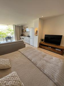 A television and/or entertainment centre at Chic and Comfortable Studio