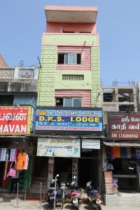 a building with motorcycles parked in front of it at DKS Lodge in Vellore