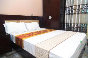 Ένα ή περισσότερα κρεβάτια σε δωμάτιο στο Eden palace