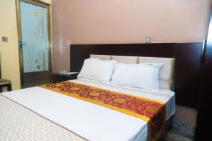 Ένα ή περισσότερα κρεβάτια σε δωμάτιο στο Eden palace