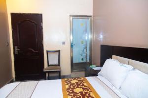 Ένα ή περισσότερα κρεβάτια σε δωμάτιο στο Eden palace