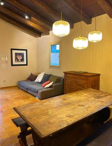 a living room with a couch and a table at Cà Sabbioso in Dozza