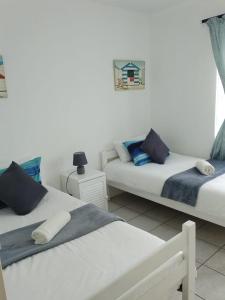Postel nebo postele na pokoji v ubytování Cosy Beach Vibes