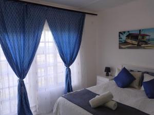 Postel nebo postele na pokoji v ubytování Cosy Beach Vibes