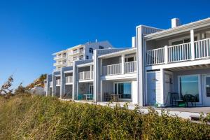 a row of white apartment buildings on the beach at Sea Bluff #5 in Santa Rosa Beach