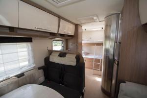an interior view of an rv with a kitchen at Autocaravaning Menorca in Ferreries