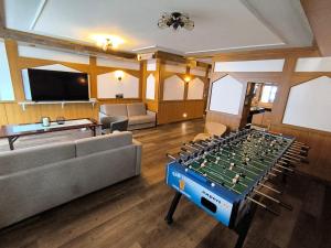 a living room with a foosball table at Smart Resorts B&B 1 BB1 200 in Winterberg