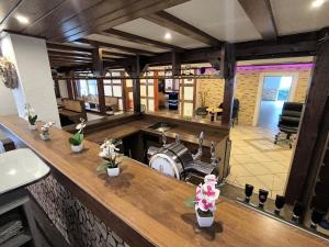 a large room with a counter with flowers on it at Smart Resorts B&B2 BB2 308 in Winterberg