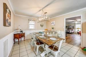 a kitchen and dining room with a table and chairs at about 1 Mi to Dollywood Family Home with Pool and Hot Tub in Pigeon Forge