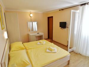 Postel nebo postele na pokoji v ubytování Guest House Sandra