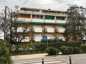 an apartment building on the side of a street at Stella Toscana Apartments in Forte dei Marmi