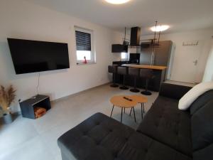 a living room with a couch and a table at Natur Oase 1 in Goch