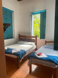 Postel nebo postele na pokoji v ubytování Pousada e Camping Lumiar
