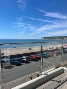 a view of a parking lot next to the beach at Mariners Hotel in Seaton
