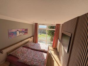 Postel nebo postele na pokoji v ubytování Ferienhaus-Maxe-Wohnung-Hannah