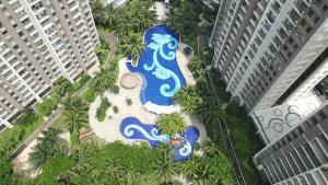 an aerial view of a fountain in a resort at Sky House BSD in Samporo
