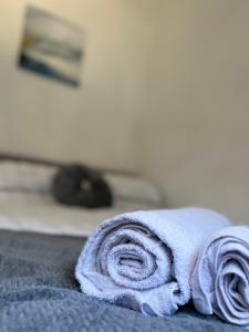 Ένα ή περισσότερα κρεβάτια σε δωμάτιο στο The Cozy Inn +9 φωτογραφίες
