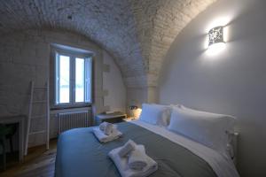 Postel nebo postele na pokoji v ubytování Palazzo Principe Umberto