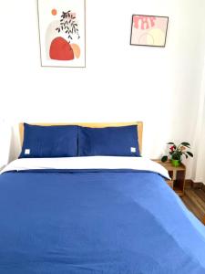 Ένα ή περισσότερα κρεβάτια σε δωμάτιο στο MiLo Home Đà Lạt