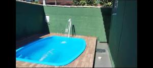 a bath tub with a fountain in a bathroom at Vivamar in Cabo Frio