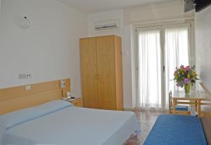 Voodi või voodid majutusasutuse Albergo La Sirenella toas