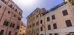 a group of buildings in a street with the sky at Effe Luxury Rooms in Rome