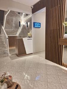 a lobby with a sign that reads sdz spa at Ador El Mar in Leptokarya