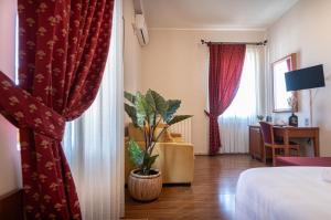 TV a/nebo společenská místnost v ubytování Sottoassisi - Guest House