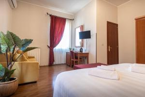 Postel nebo postele na pokoji v ubytování Sottoassisi - Guest House