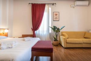 Postel nebo postele na pokoji v ubytování Sottoassisi - Guest House
