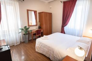 Postel nebo postele na pokoji v ubytování Sottoassisi - Guest House