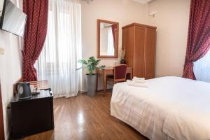 Postel nebo postele na pokoji v ubytování Sottoassisi - Guest House
