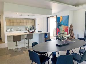a kitchen and dining room with a table and chairs at Villa La Cupulatta by Interhome in Sainte-Lucie de Porto-Vecchio