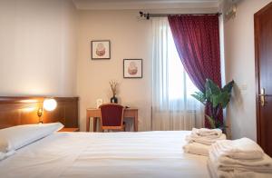 Postel nebo postele na pokoji v ubytování Sottoassisi - Guest House