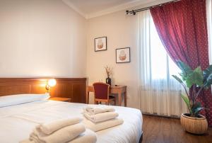 Postel nebo postele na pokoji v ubytování Sottoassisi - Guest House