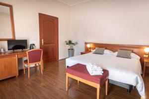 Postel nebo postele na pokoji v ubytování Sottoassisi - Guest House