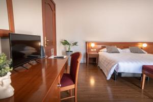 Postel nebo postele na pokoji v ubytování Sottoassisi - Guest House