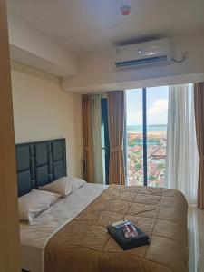Ένα ή περισσότερα κρεβάτια σε δωμάτιο στο Apartment Hot promotion A33905 Pollux Habibi Batam without wifi