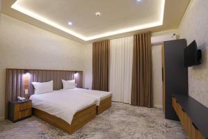 Ένα ή περισσότερα κρεβάτια σε δωμάτιο στο Florence Hotel